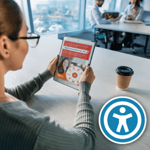 Frau sitzt mit einem barrierfreien eBook in einem hellen Büro und liest es